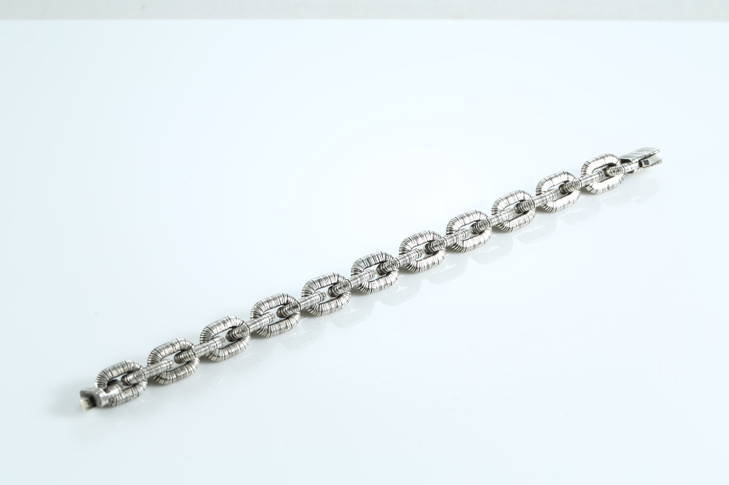 Sterling silver bracelet with textured links and anchor