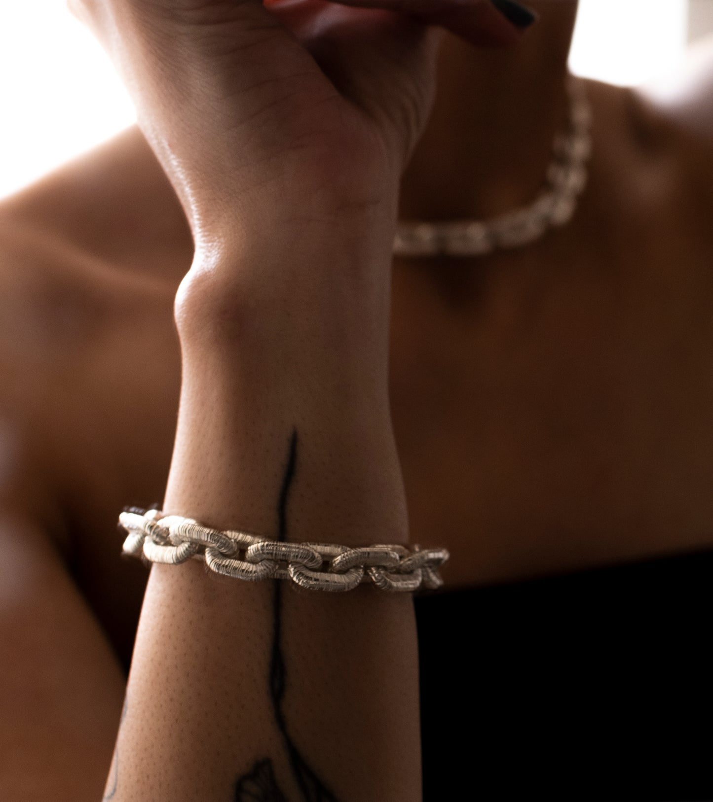 Sterling silver bracelet with textured links and anchor