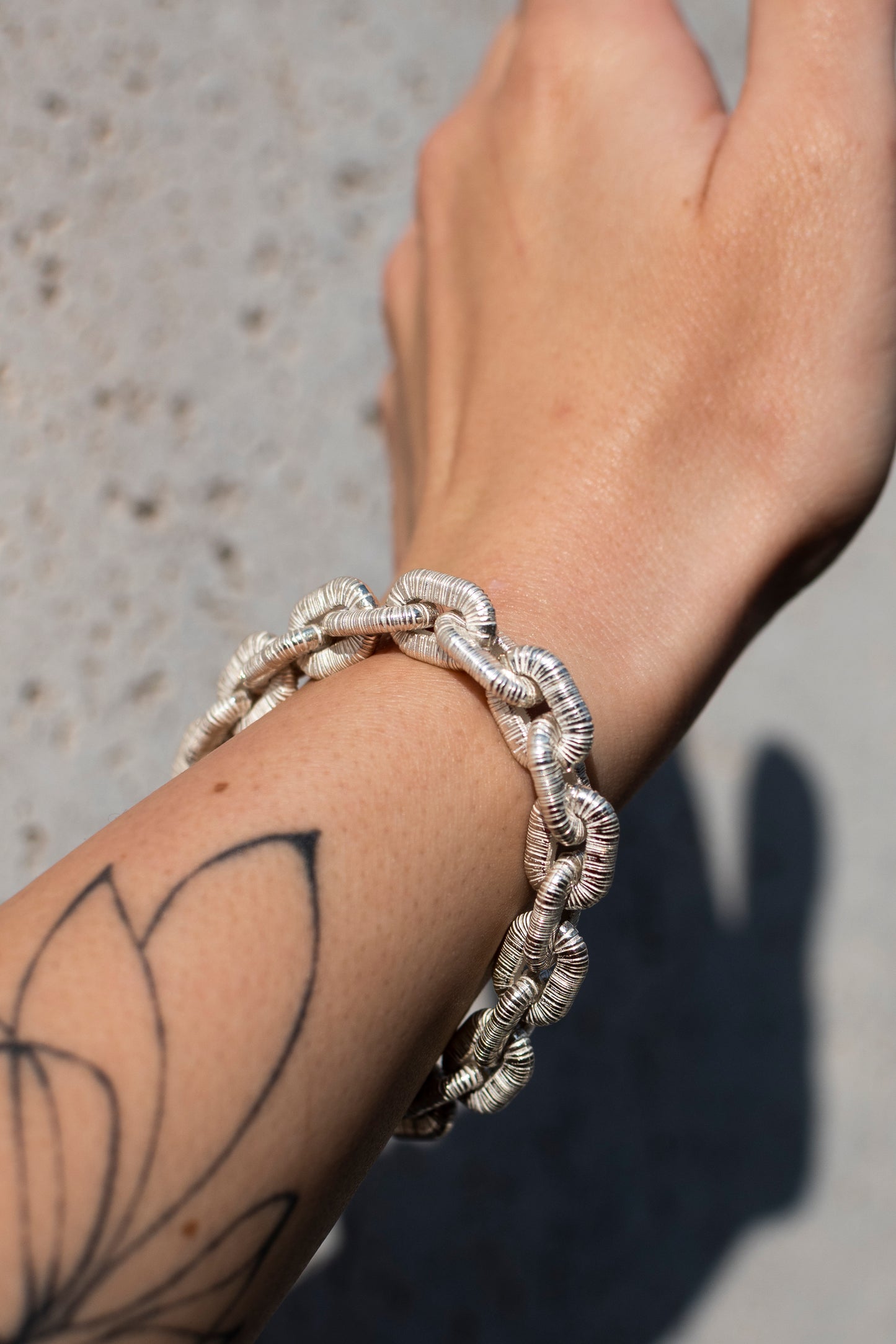 Sterling silver bracelet with textured links and anchor