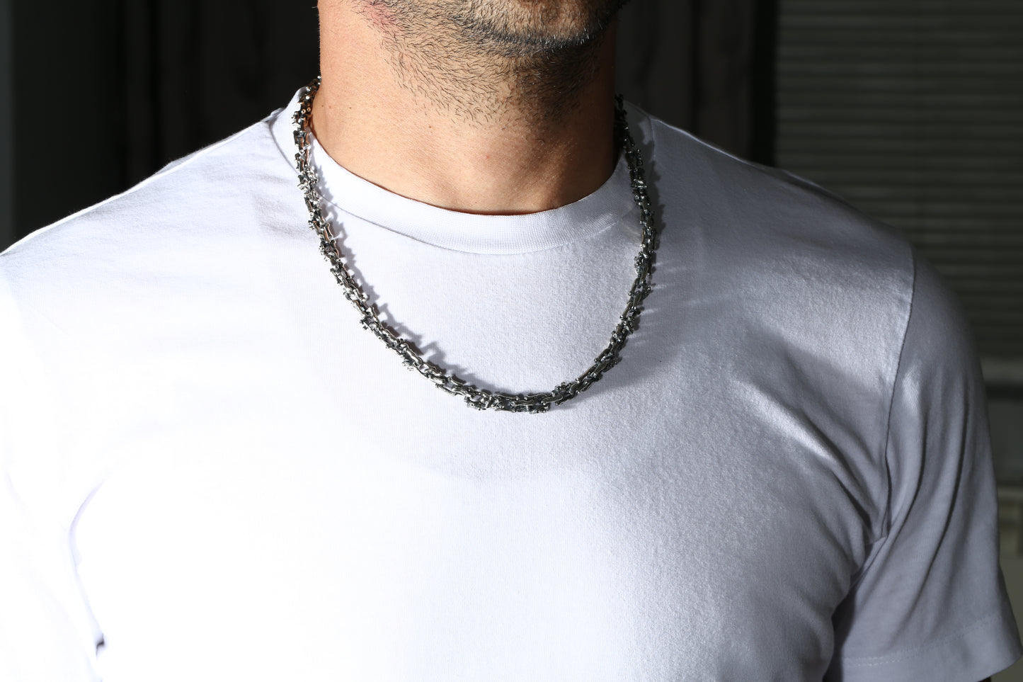 Silver necklace in the shape of a branch