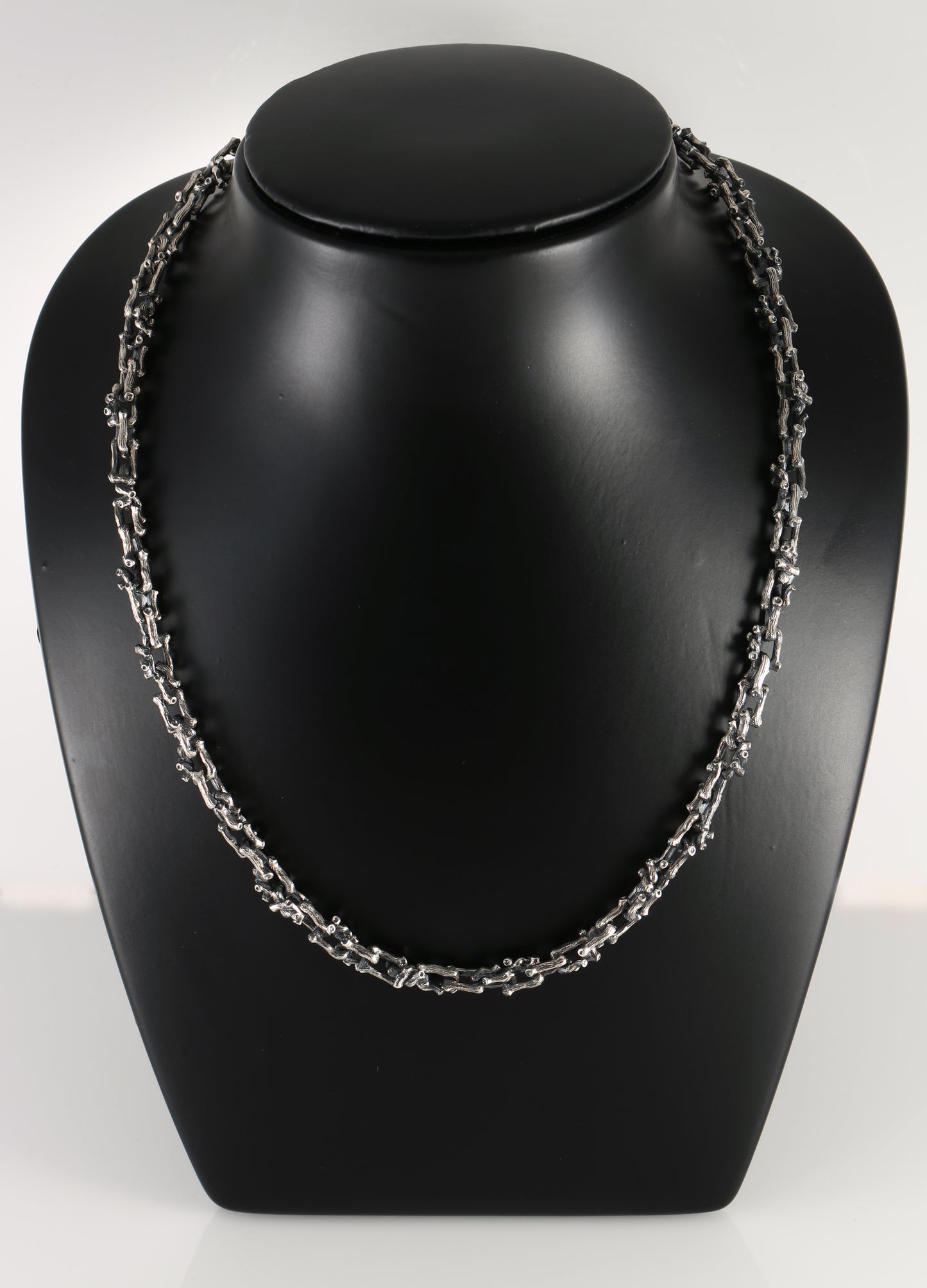 Silver necklace in the shape of a branch