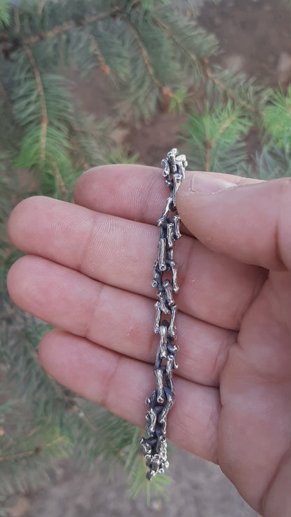Silver necklace in the shape of a branch